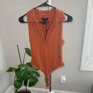 House of Harlow 1960 Burnt Orange bodysuit size small NWT